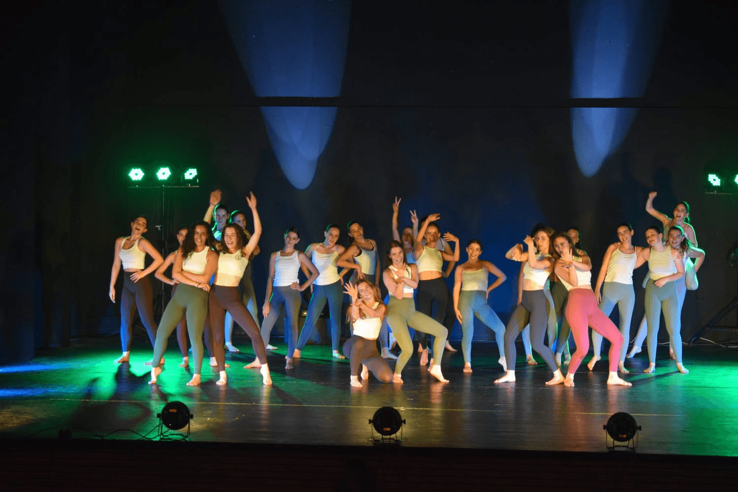 Group finale performance with colorful lighting