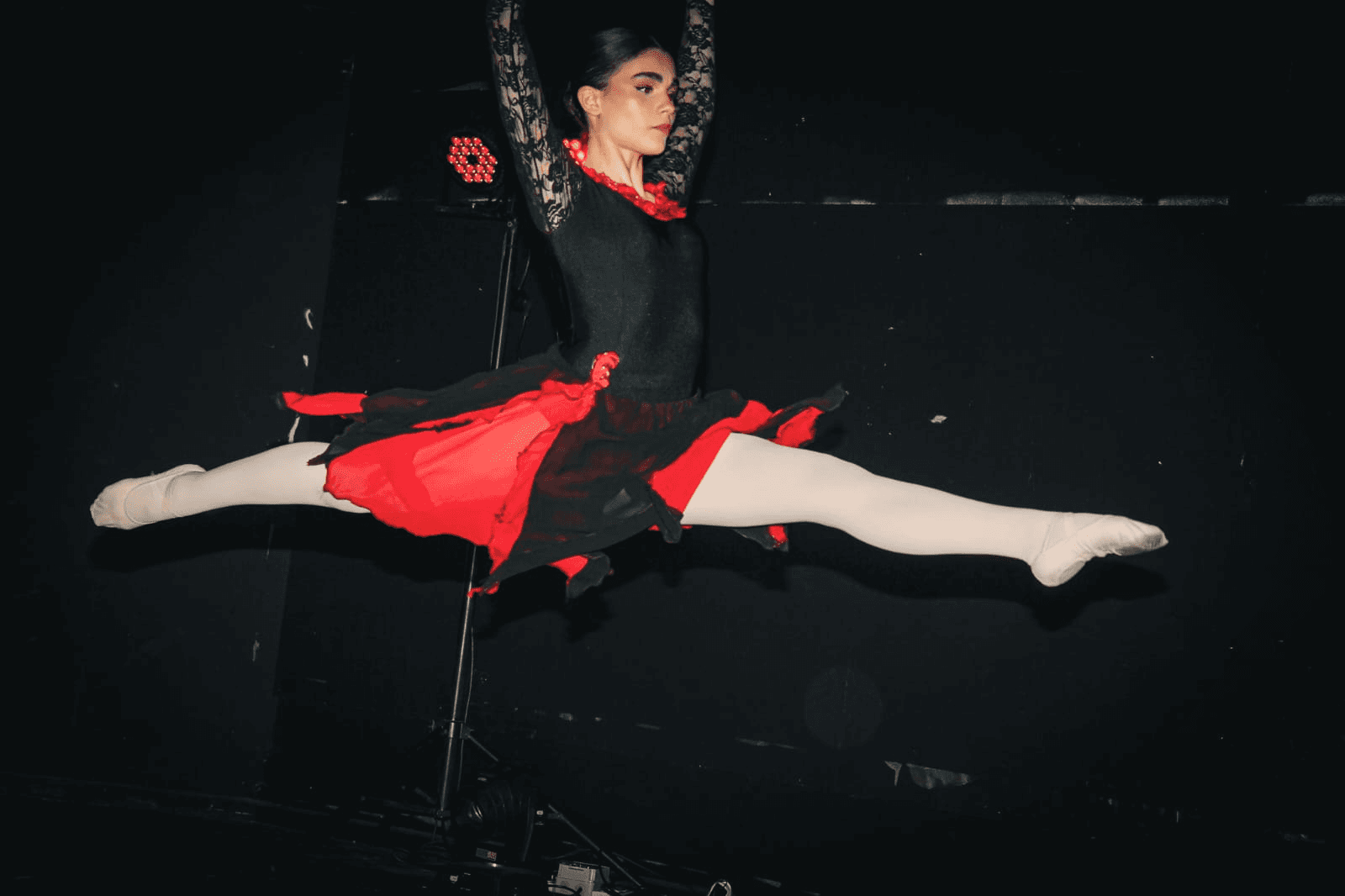 Ballet split jump performance at end of year show